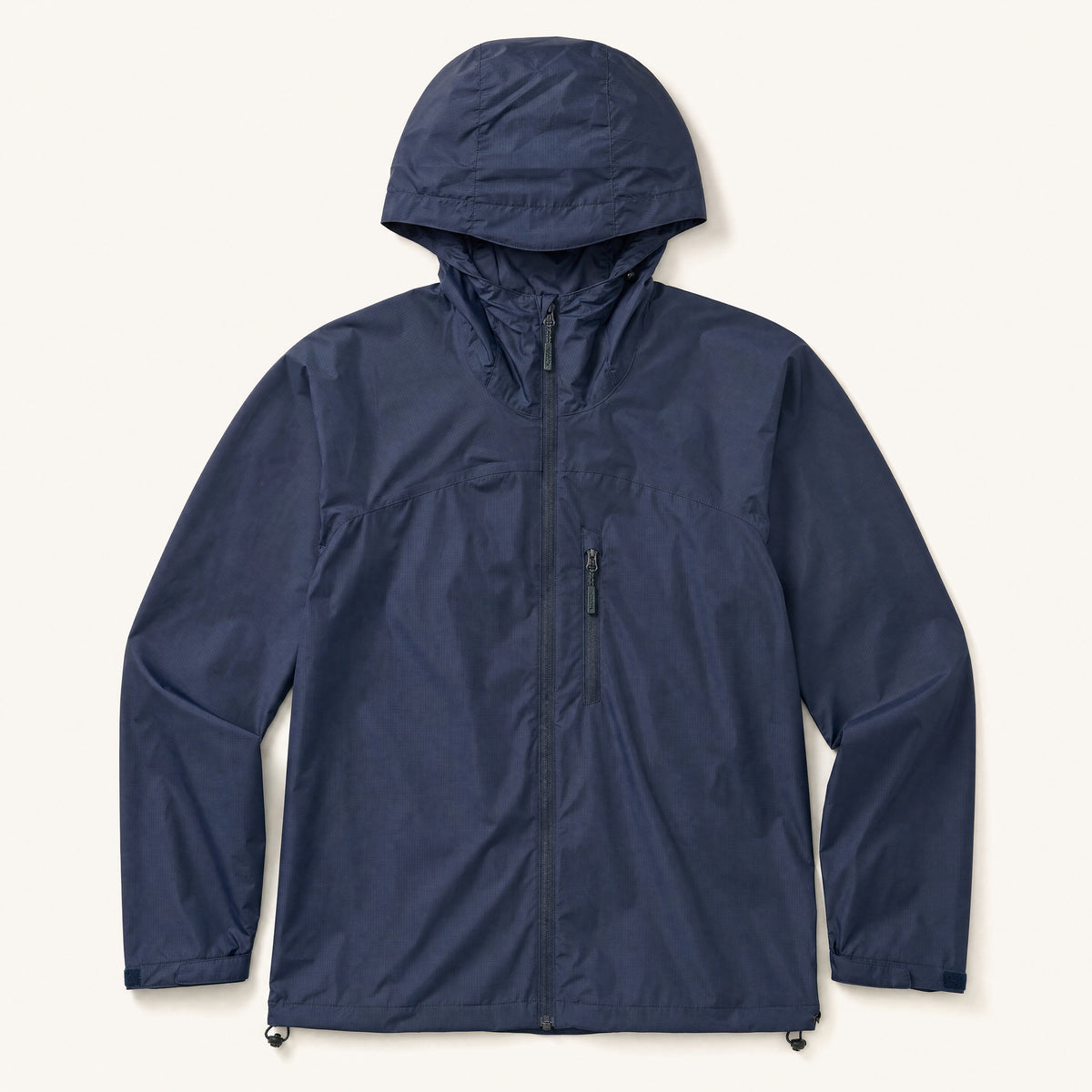 The Gale Men's Lightweight Hooded Shell Jacket in Storm Navy, front flat lay
