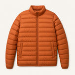 The Treeline Men's Quilted Puffer Jacket in Burnt Orange, front flat lay