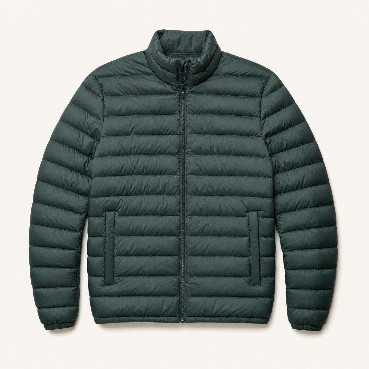The Treeline Men's Quilted Puffer Jacket in Pine Green, front flat lay