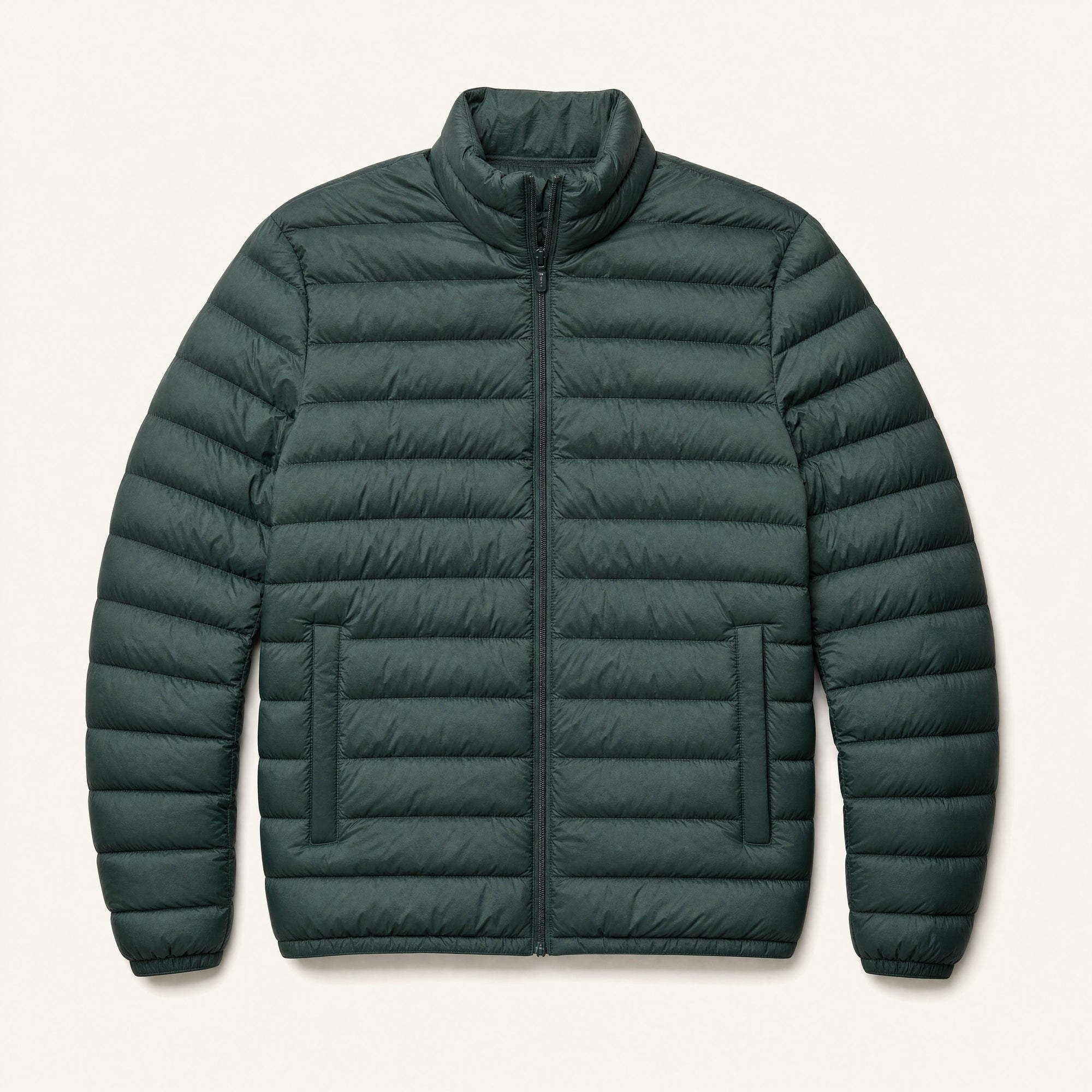The Treeline Men's Quilted Puffer Jacket in Pine Green, front flat lay